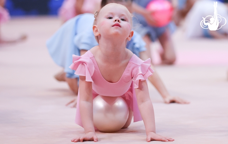 Young gymnast performing at the opening ceremony of the all-Russian Sky Grace Cup competition