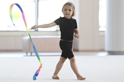 Young gymnast in a training class at the Academy