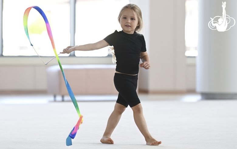 Young gymnast in a training class at the Academy