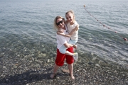 Coach Elena Berkova with a gymnast on the beach