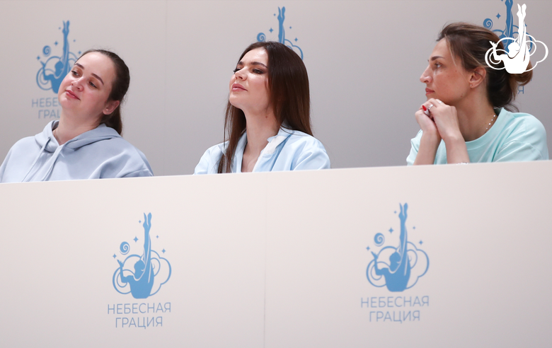 Marina Shpekht, Alina Kabaeva and Irina Dzyuba watch gymnasts perform at the assessment training session (left to right)