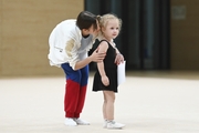 Academy coach Elizaveta Chernova with a young gymnast