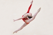 A gymnast performs a split jump at the All-Russian competition "Victory Formula"