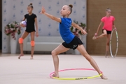 Gymnast during an exercise with a hoop during floor testing