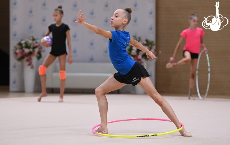 Gymnast during an exercise with a hoop during floor testing