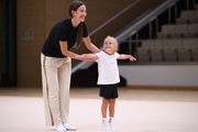 Academy coach Elizaveta Chernova with a young gymnast during the selection