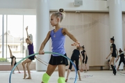 Gymnast practicing hoop element during training