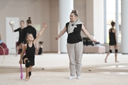 Coach Evgenia Eliseeva with gymnasts during class