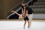 Academy coach Elizaveta Chernova with a young gymnast during the selection process