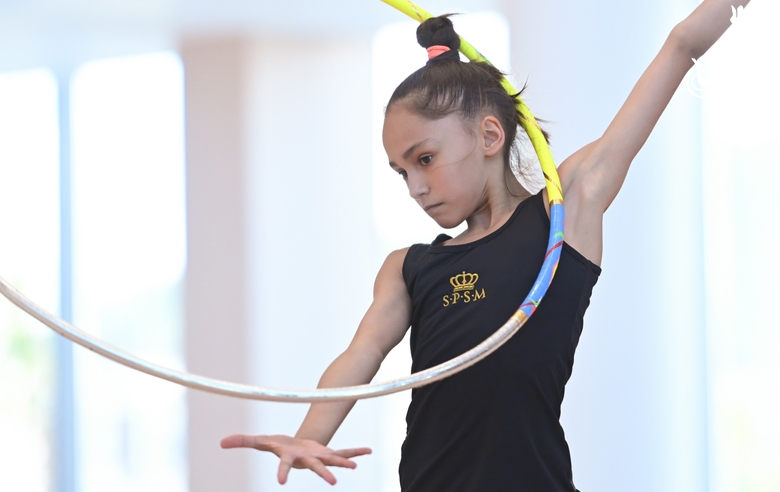 Valeria Medvedeva doing an exercise with a hoop