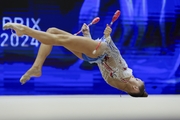 Gymnast during an exercise with clubs