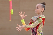 Yana Zaikina during an exercise with clubs at an assessment training session