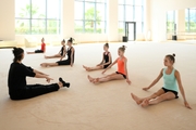 Gymnasts and choreographer Vera Arbuzova at a training session during the recovery camp at the Academy