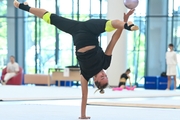 Maria Pobedushkina performs an element during an exercise with a ball