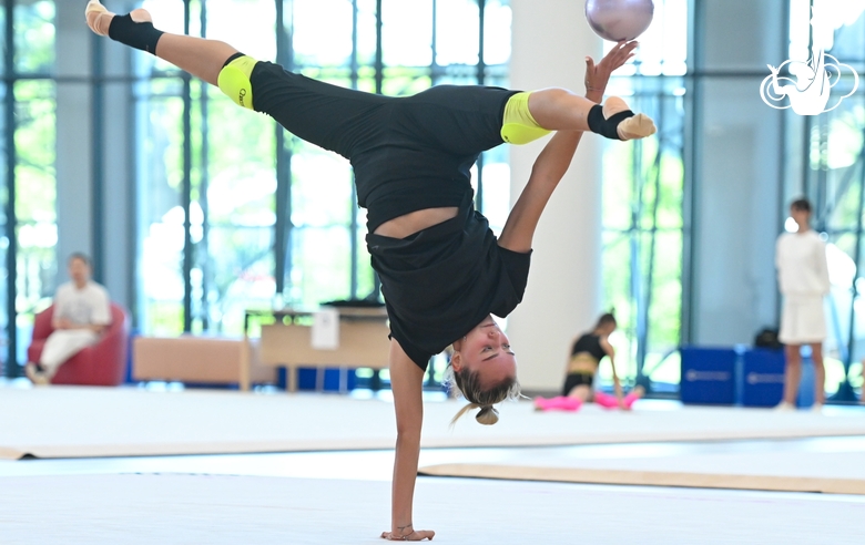 Maria Pobedushkina performs an element during an exercise with a ball