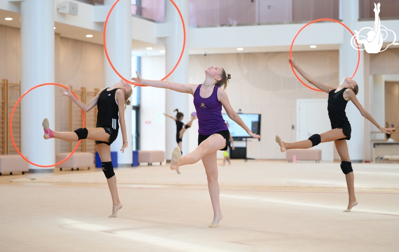 Gymnasts performing an exercise with hoops