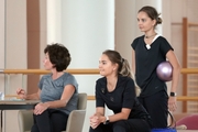 Choreographer Irina Zenovka, Dina and Arina Averina during the training session in the Academy