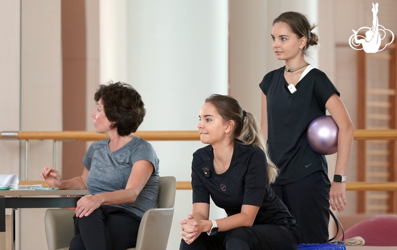 Choreographer Irina Zenovka, Dina and Arina Averina during the training session in the Academy