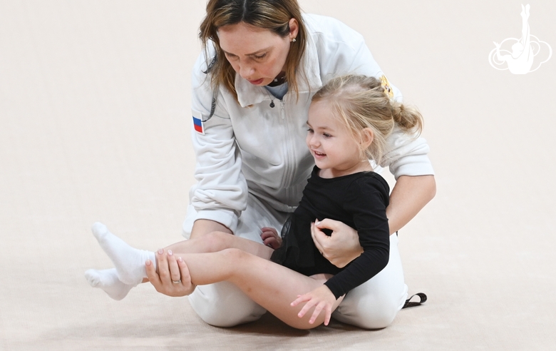 Academy Coach Olesya Kovaleva with a young gymnast during the selection