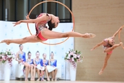 Gymnasts during an exercise with hoops