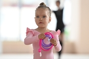 Young gymnast during an exercise with a jump rope