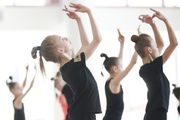 Gymnasts work on movements during  choreography