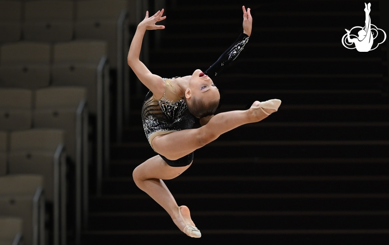 Gymnast performs a jump during the Formula of Victory competition