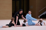 Academy coaches with young gymnasts during the selection process