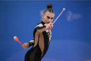 Ekaterina Sazonova during an exercise with clubs