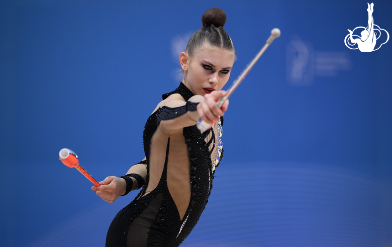 Ekaterina Sazonova during an exercise with clubs