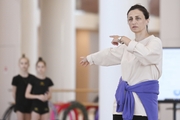 Academy coach Irina Dzyuba with gymnasts during class