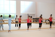 Gymnasts and Academy choreographer Ekaterina Belova during choreography