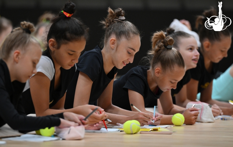Gymnasts during a session with a psychologist at the training camp in the Academy