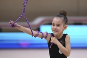 Young gymnast during an exercise with a jump rope at the mAlinka tournament