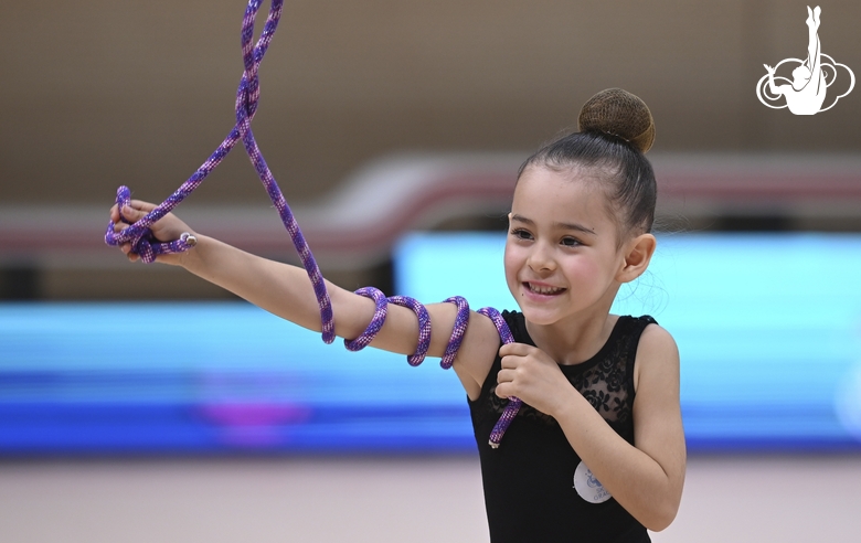 Young gymnast during an exercise with a jump rope at the mAlinka tournament