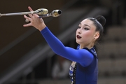 Gymnast during an exercise with clubs