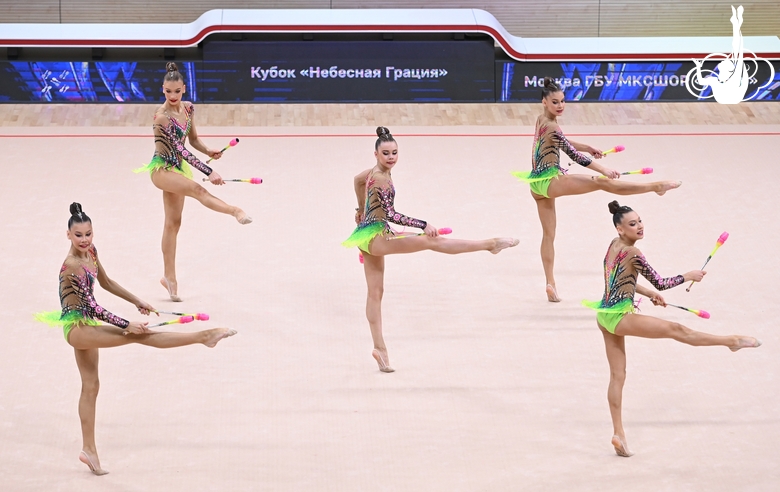 Gymnasts during an exercise with clubs