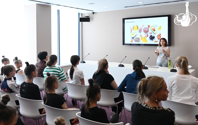 Nutritionist Anna Turusheva gives a lecture for camp participants and coaches