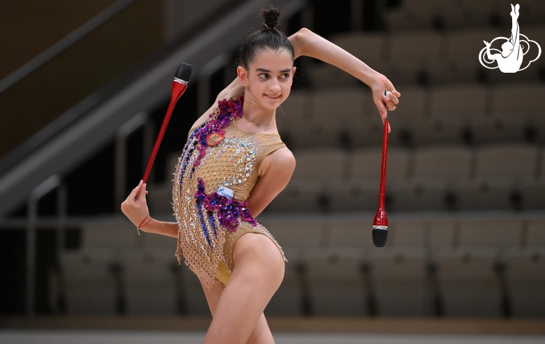 Anna Vakulenko during an exercise with clubs  during a control training session