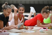 Gymnasts during a session with a psychologist at the training camp in the Academy