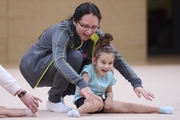 Academy coach Alla Mishenina with a young gymnast during the selection process