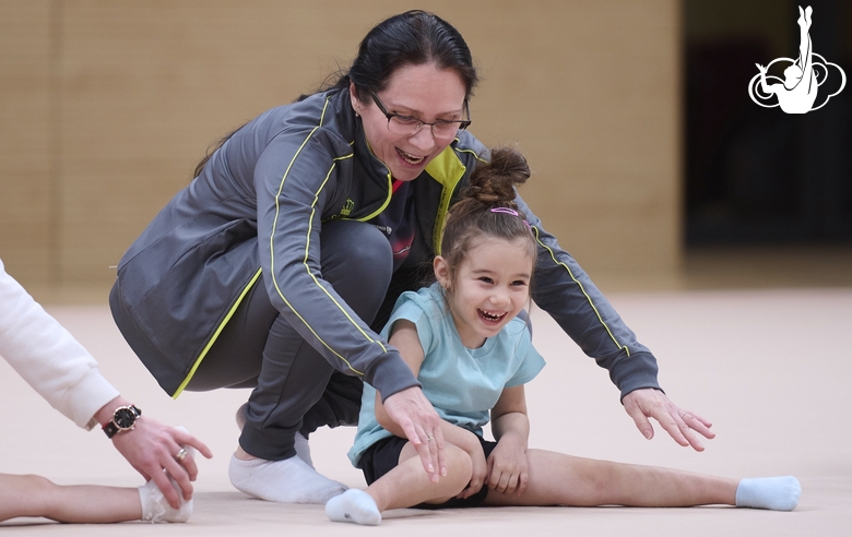 Academy coach Alla Mishenina with a young gymnast during the selection process