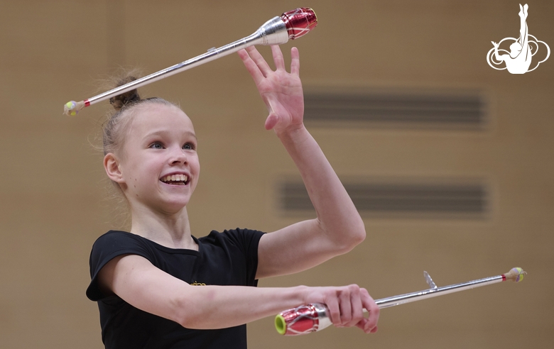 Kristina Voitenko during an exercise with clubs