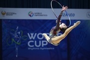 Takhmina Ikromova during an exercise with hoop