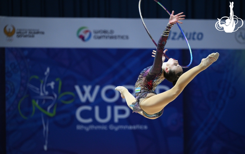 Takhmina Ikromova during an exercise with hoop