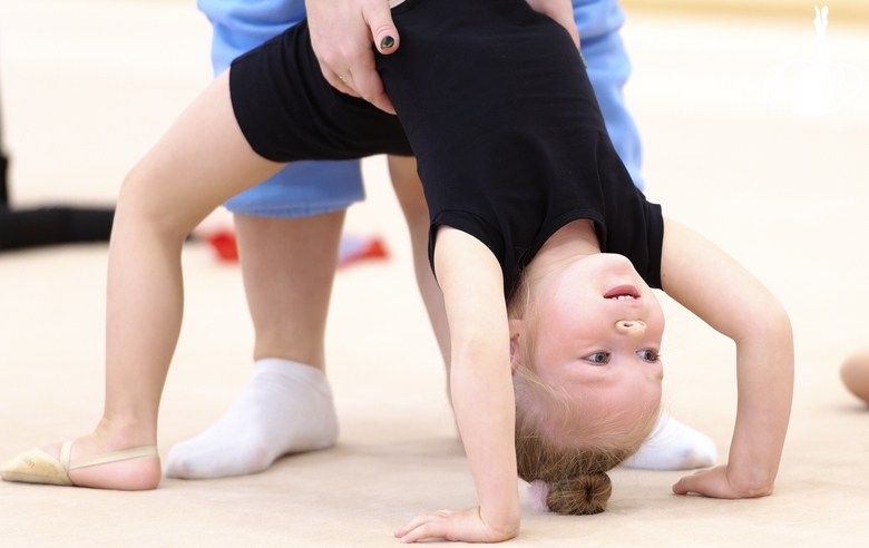 Young gymnast during training