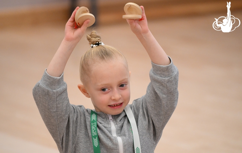 A young gymnast during a rhythmic gymnastics class