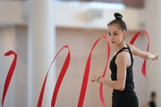 Mariia Borisova  during an exercise with a ribbon during training at the Academy