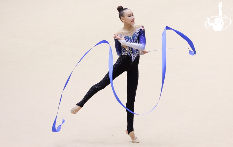 Nika Kostina during an exercise with a ribbon