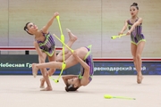 Gymnasts during an exercise with clubs